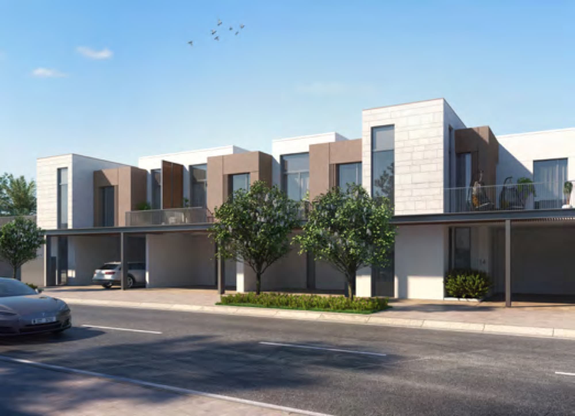 Street view of Joy's stone-clad townhouse terrace with covered carports, Arabian Ranches 3, Dubai.